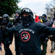 A protester who declared himself to be a member of the Proud Boys, center, seen here amid other Donald Trump supporters outside the Capitol on Jan. 6.